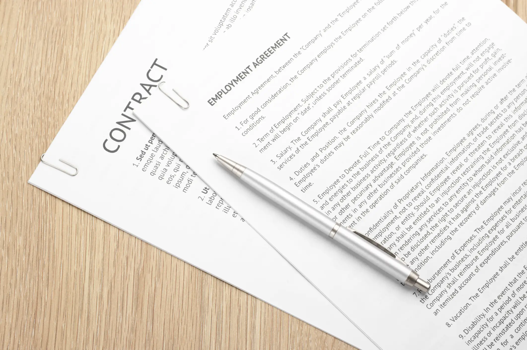 employment agreement contract on a desk