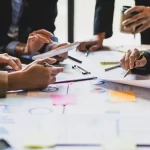 group of solicitors sat around a table having a conversation