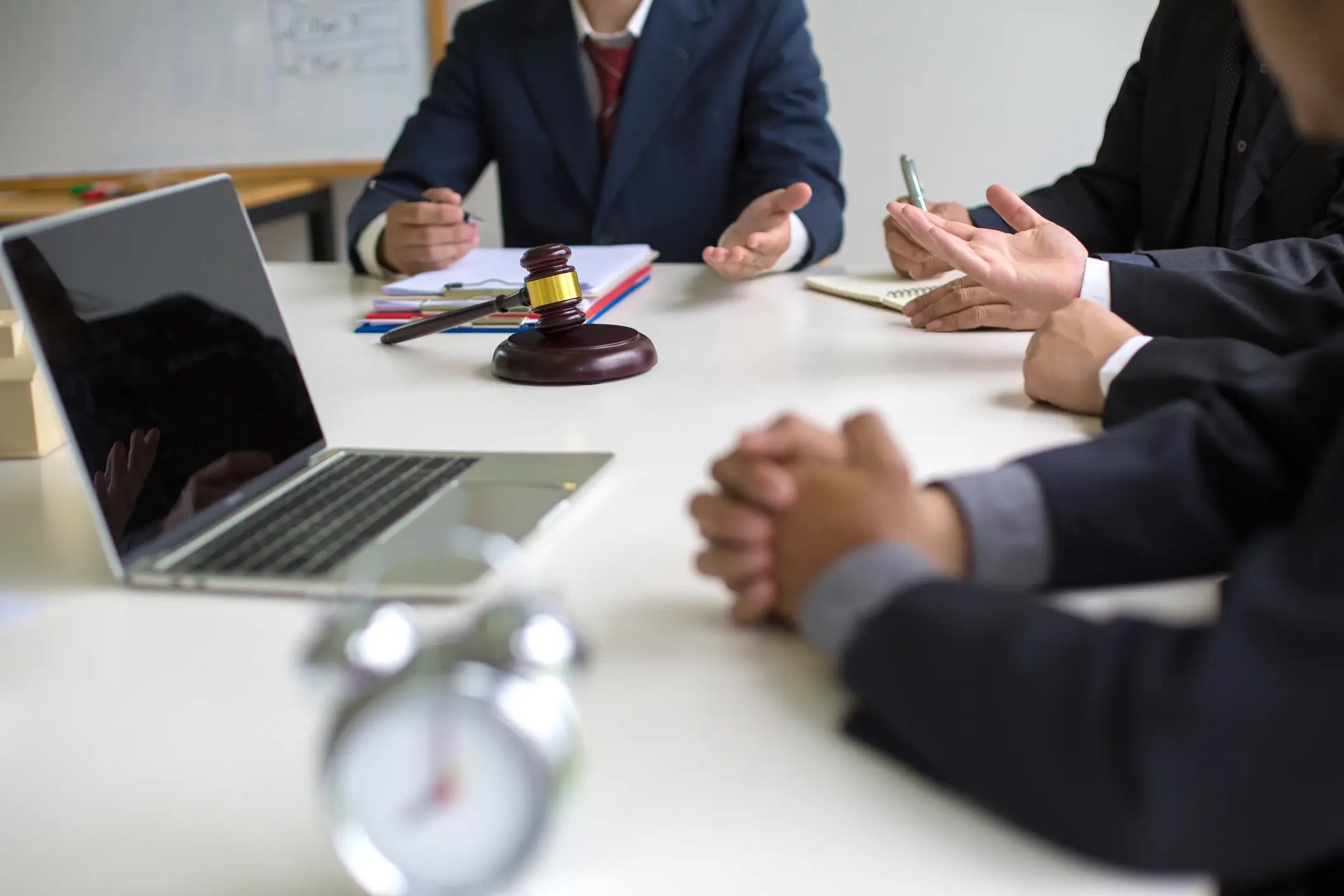 group of solicitors discussing around a table