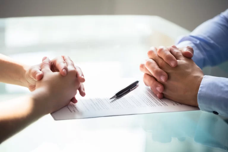 2 people discussing legal documents
